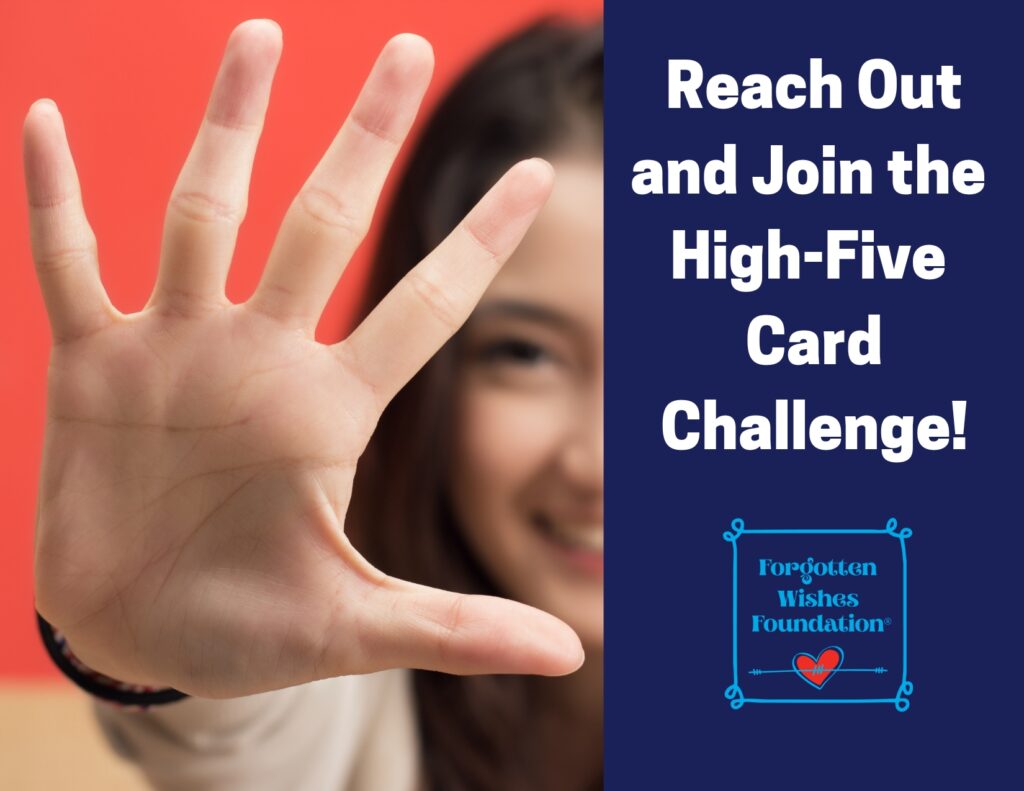 Woman holding up her hand in front of her in a High-Five gesture