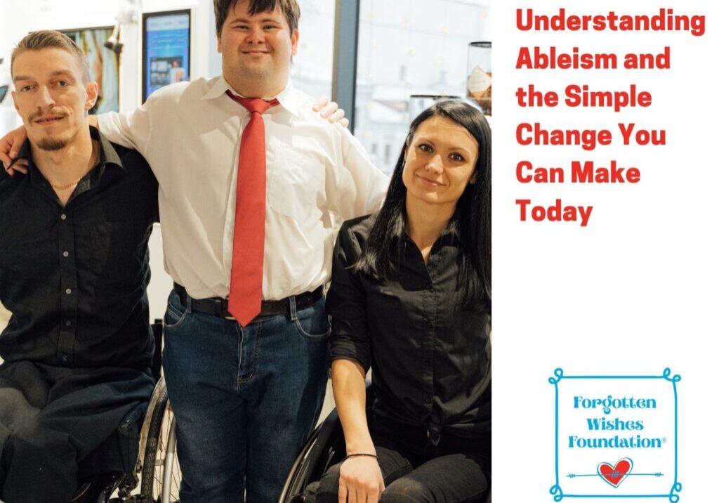 Two individuals using a wheel chair sit next to a young man in a white shirt and red tie. The image is reflective of people with disabilities