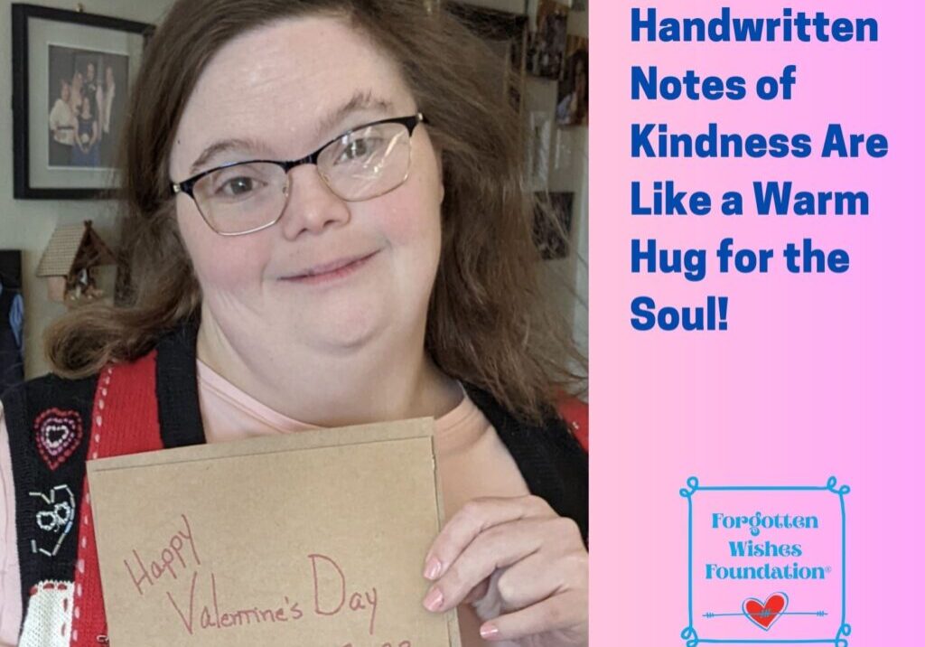 A Girl with Down Syndrome is holding a handwritten card from the Forgotten Wishes Foundation